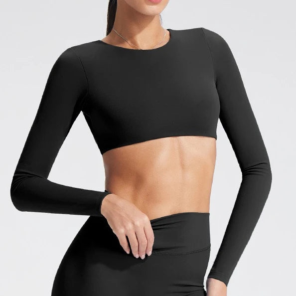 Women's long-sleeved yoga top with built-in breast pads, breathable and comfortable, suitable for gym workouts and fitness.